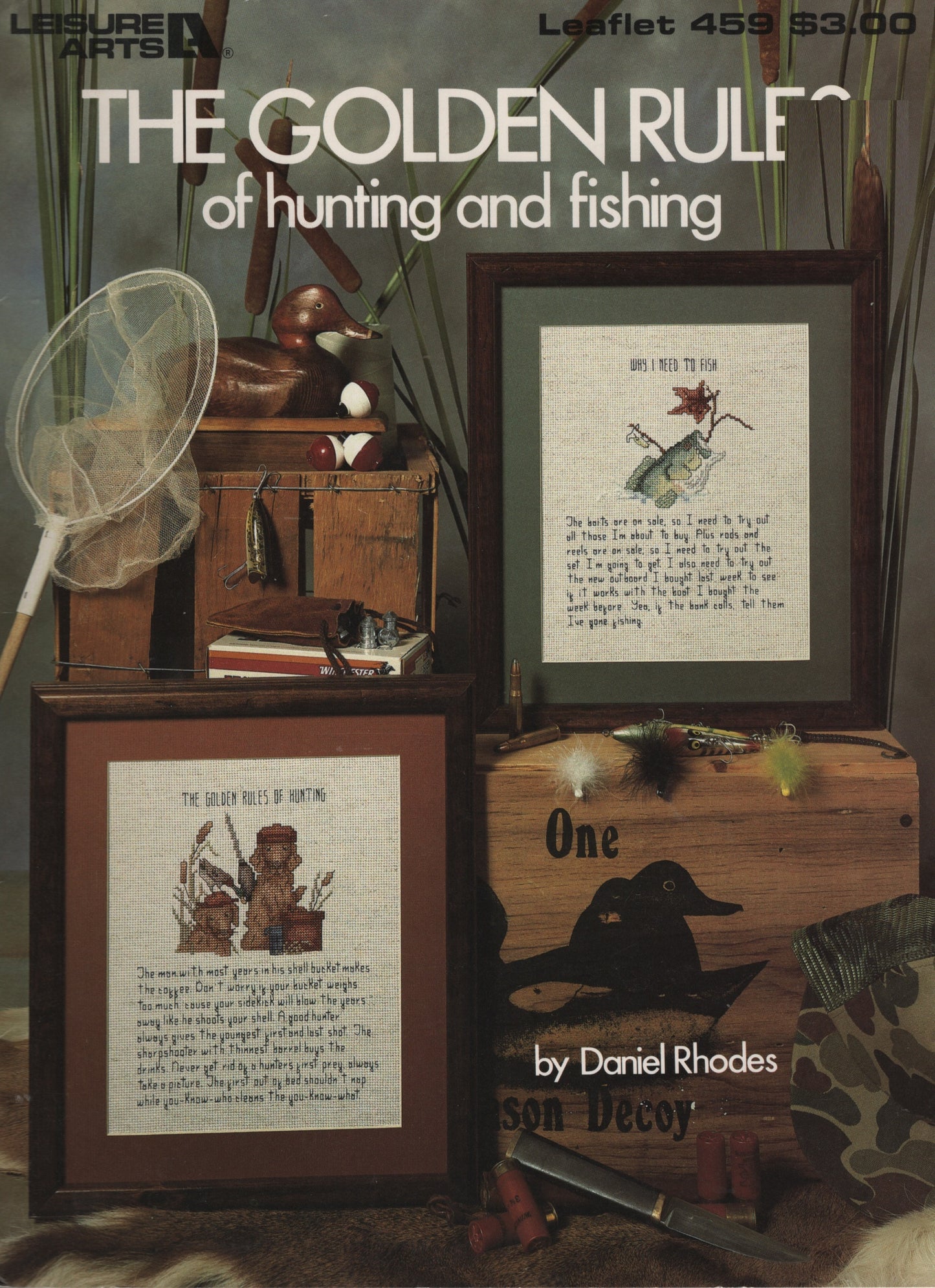 A vintage-style leaflet cover titled "The Golden Ruff of hunting and fishing," showing framed artwork with duck illustrations, a duck net, a wooden chest, and fishing-related props in a rustic arrangement. 459