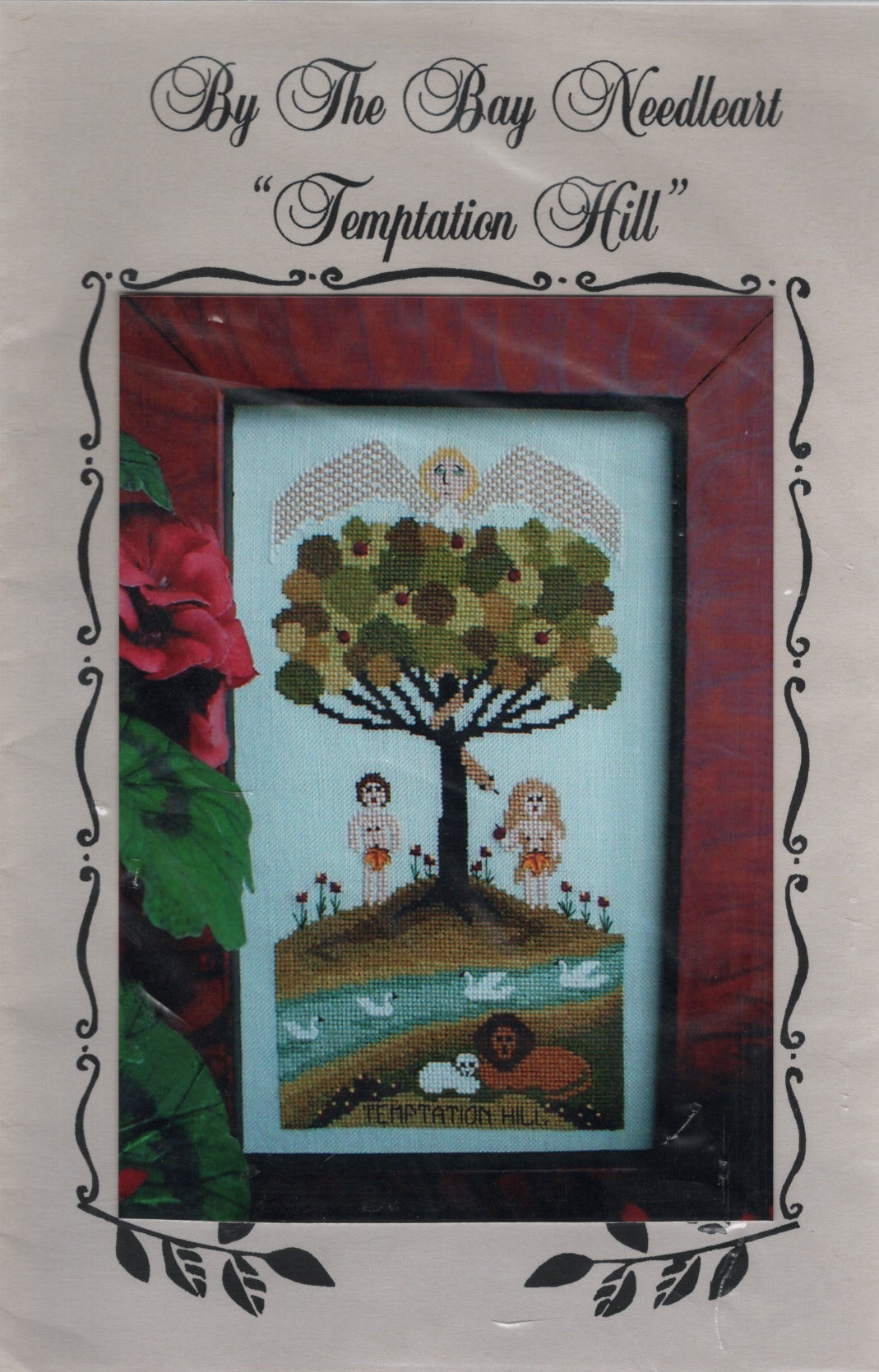 A cross stitch pattern titled "Temptation Hill" by By The Bay Needleart. The central stitched scene depicts an Apple tree, Adam & Eve, birds, and a lion on a hillside