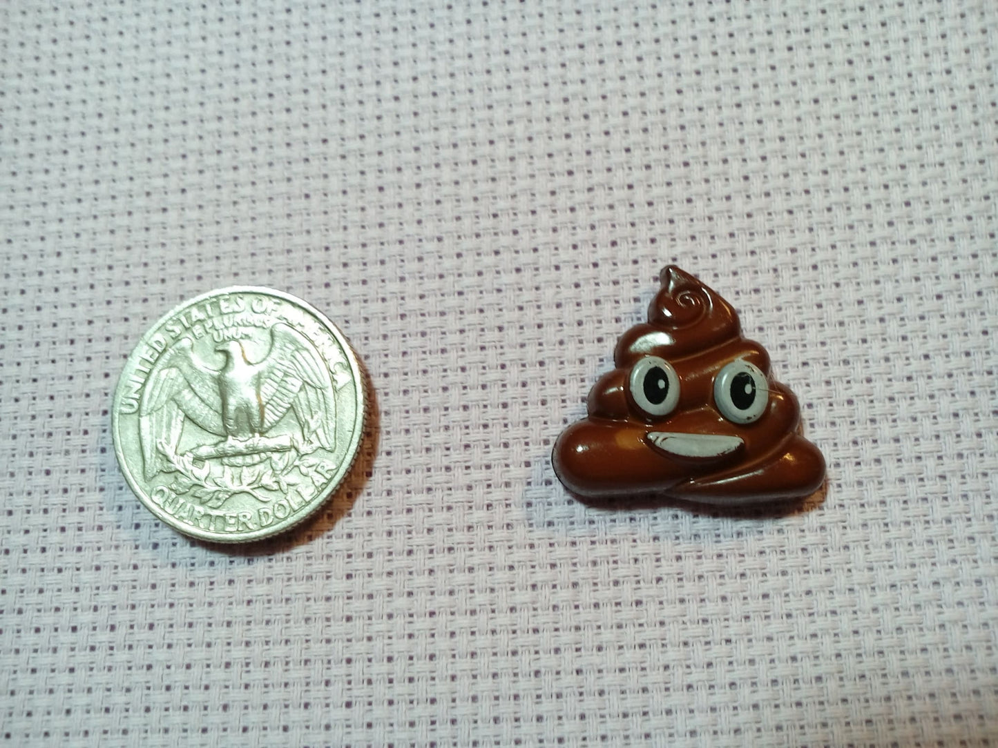 Poop emoticon cross stitch needle minder