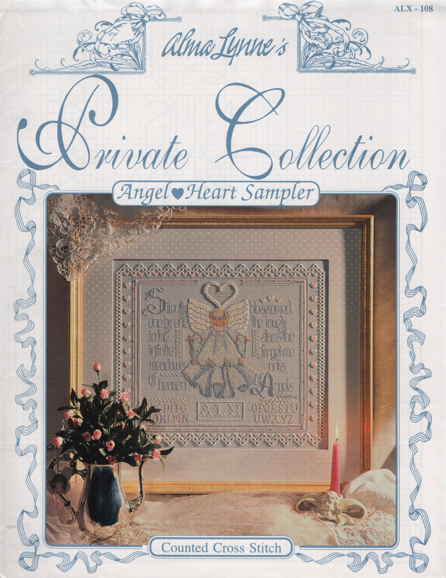 Front cover of Alma Lynne's Private Collection: Angel Heart Sampler counted cross stitch pattern book, featuring a framed sampler design with an angel motif and decorative blue border text . ALX-108
