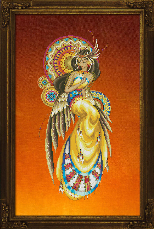 A cross stitch pattern featuring a stylized winged female figure in a flowing yellow dress with blue, red, and white patterned details, set against a warm orange-to-brown gradient background. 
