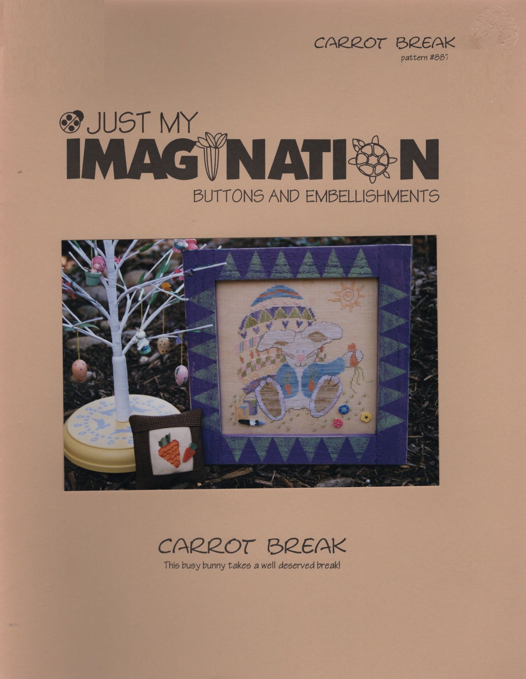 Cross Stitch Pattern 'Just My Imagination ' Carrot Break pattern #8870, featuring a central framed cross-stitch design of a blue and yellow bunny on a carrot field