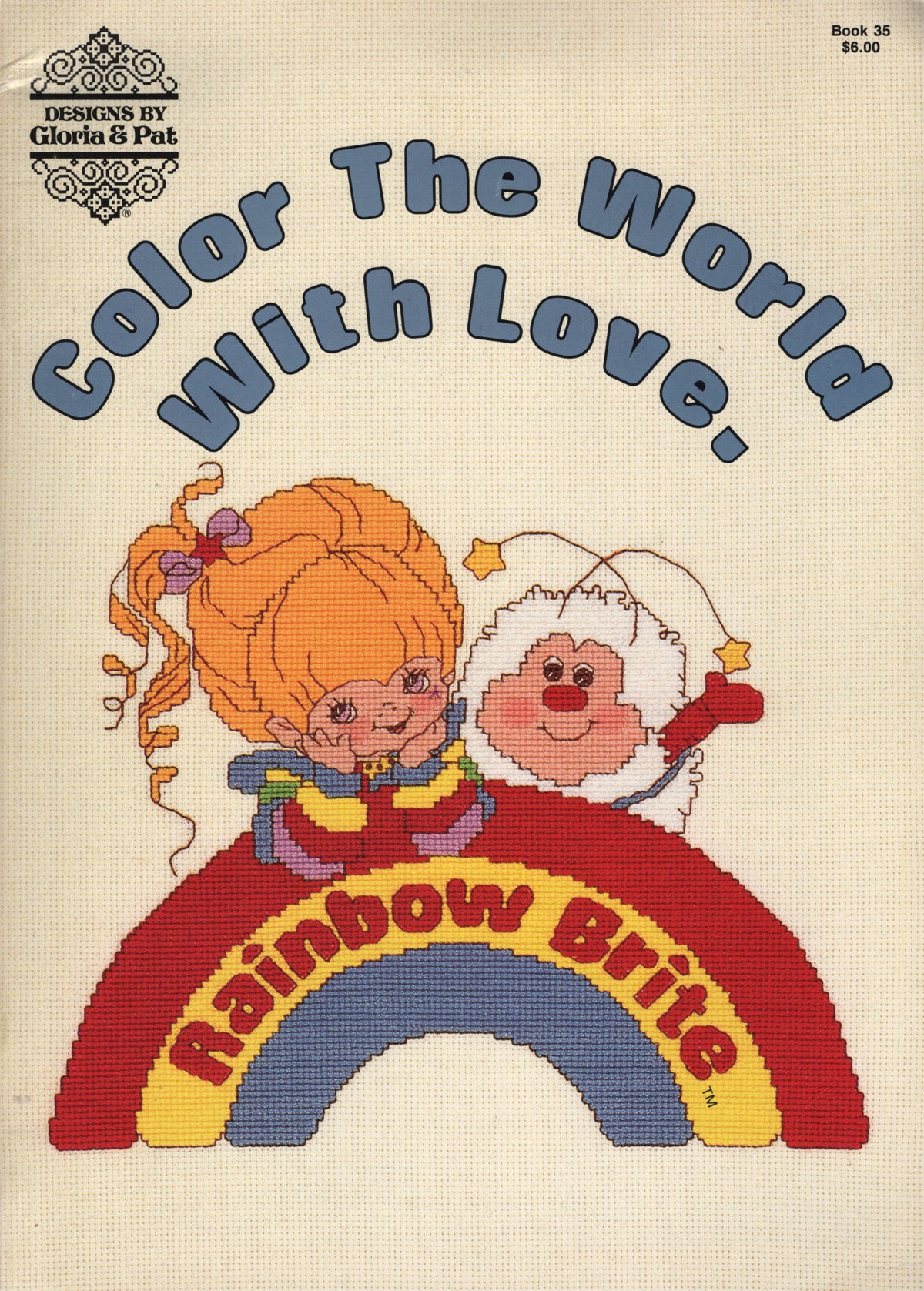 Vintage needlework pattern cover for 'Color The World With Love. Book 35 Rainbow Brite' by Gloria & Pat, 35 cross stitch pattern