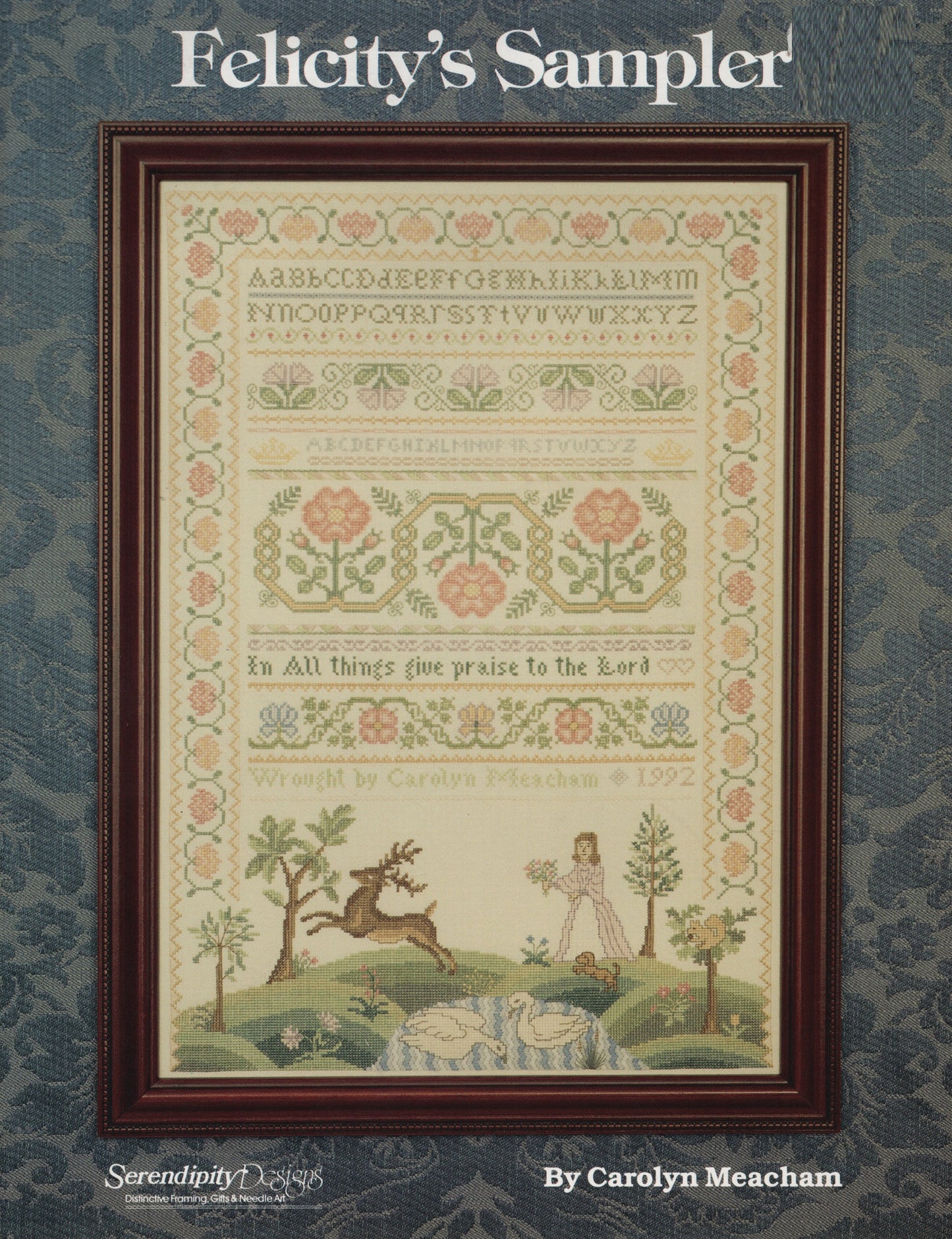 Felicity's Sampler cross-stitch pattern cover by Carolyn Meacham, featuring a framed sampler design with floral borders, alphabet embroidery, and a pastoral landscape scene at the bottom
