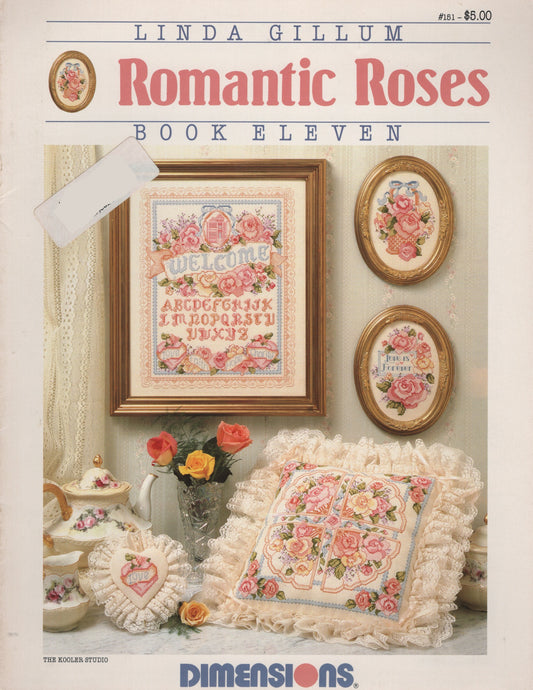 Front cover of Linda Gillum's 'Romantic Roses Book Eleven' cross stitch pattern by Dimensions, featuring a vintage-style collage of embroidered rose-themed needlework and floral home decor on an off-white background. 151