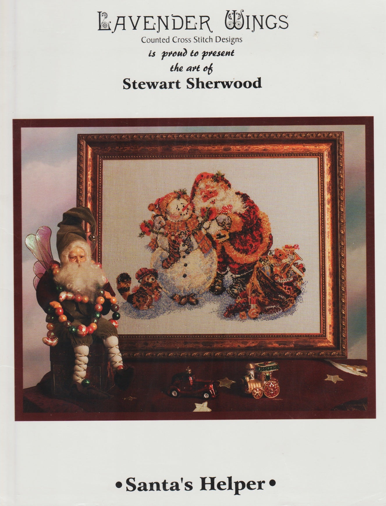 Lavender Wings Santa's Helper Christmas cross stitch pattern