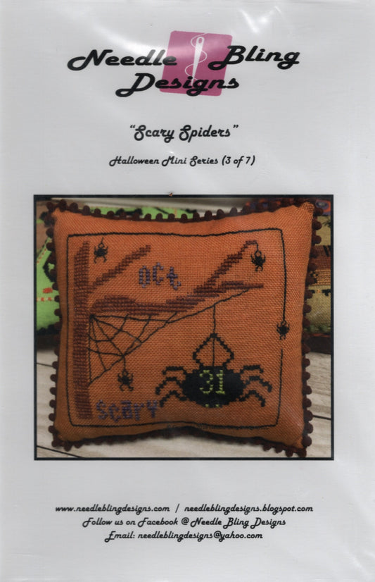 Needle Bling Designs 'Scary Spiders' Halloween Mini Series pillow pattern cover, showing an orange cross-stitch pillow with spider and spiderweb designs. NBD-137