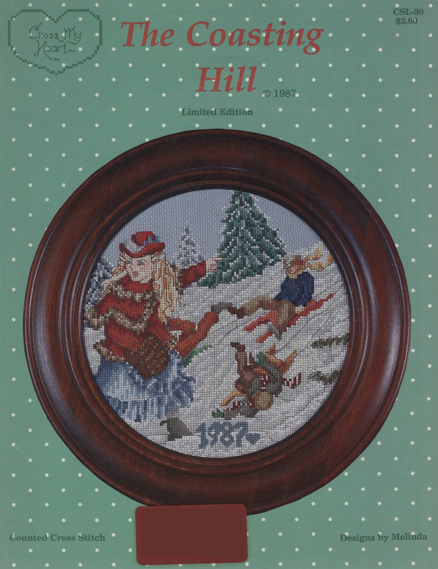 Cross-stitch pattern cover for 'The Coasting Hill' 1987 limited edition, featuring a circular framed cross-stitch design of children sledding in the snow. Cross My Heart CSL-20