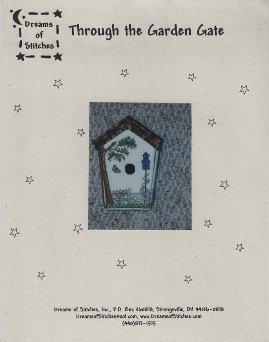 A vintage pattern cover for 'Through the Garden Gate' by Dreams of Stitches, featuring a central illustration of a birdhouse with a garden scene on a textured gray background, surrounded by small star illustrations