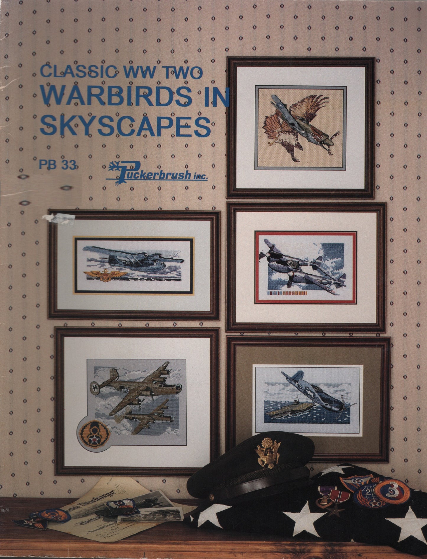 A vintage cross stitch book titled 'Classic WW Two Warbirds in Skyscapes' with five airplane illustrations  by Puckerbrush PB33