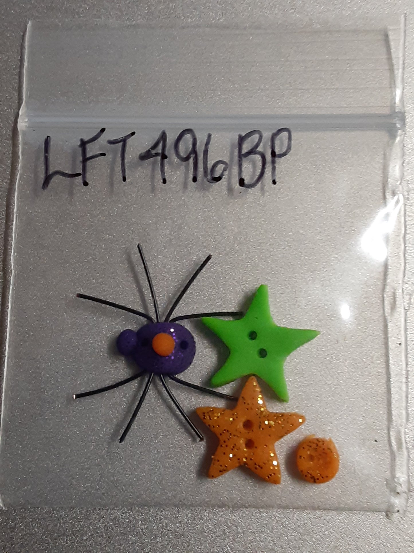 Stoney Creek Extra small orange glitter simple, small/medium orange glitter star, small/medium glow green star and small purple glitter spider buttons for Stoney Creek's Leaflet 496 Halloween Friends.