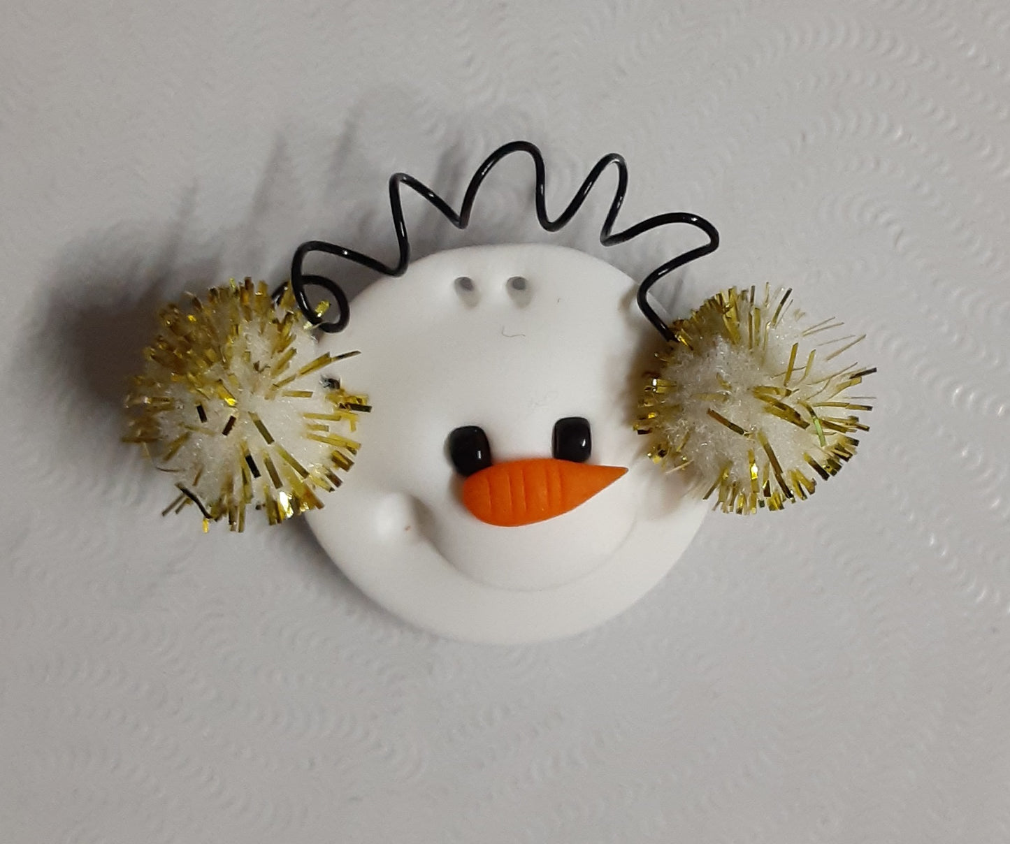 Snowman with Earmuffs button